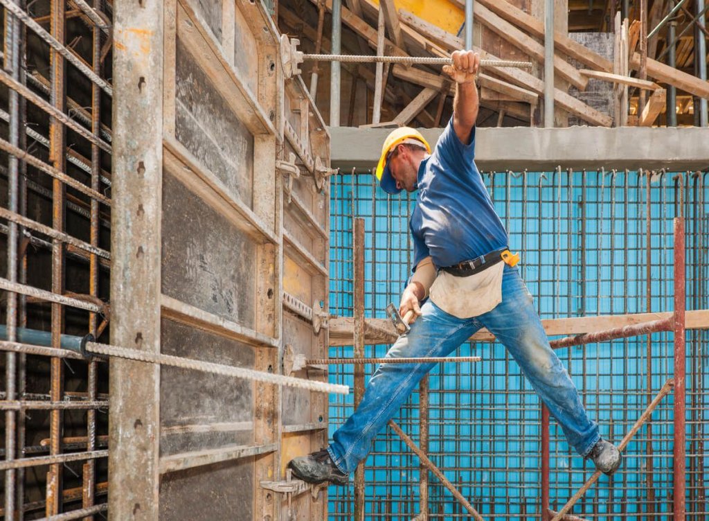 construction worker making unsafe choice on construction site.