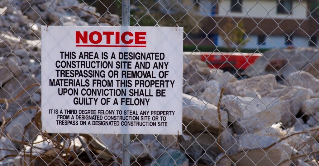 security sign on fence of construction site.