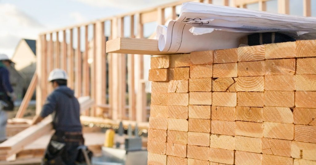 stack of lumber on construction site.