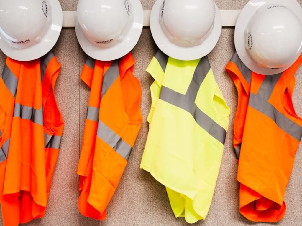 construction hard hats and safety vests.