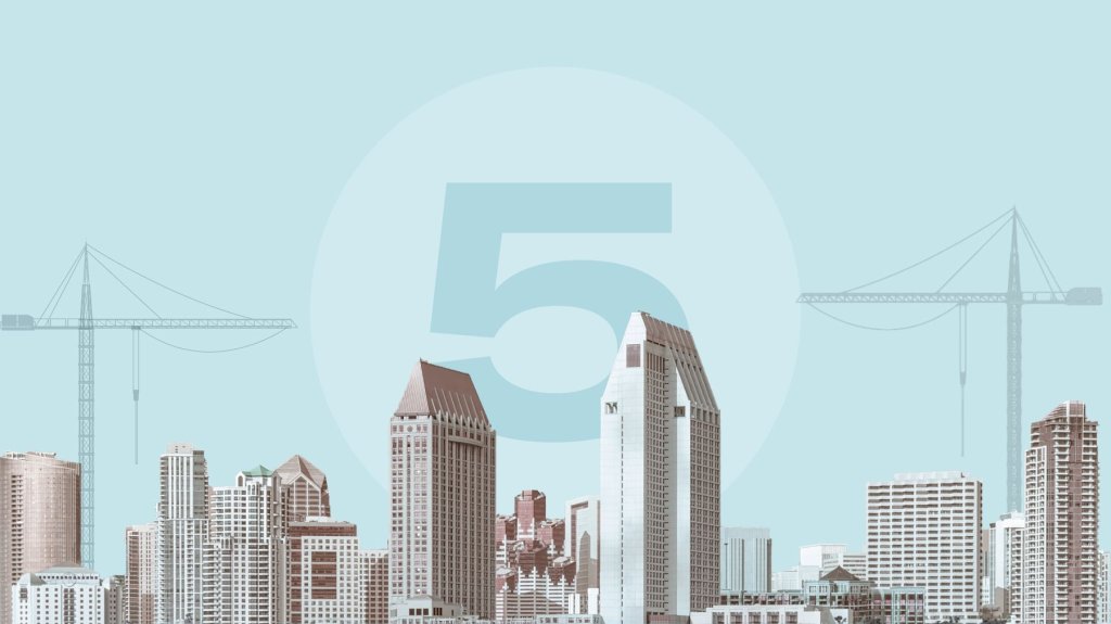 City skyline with construction equipment and number 5.