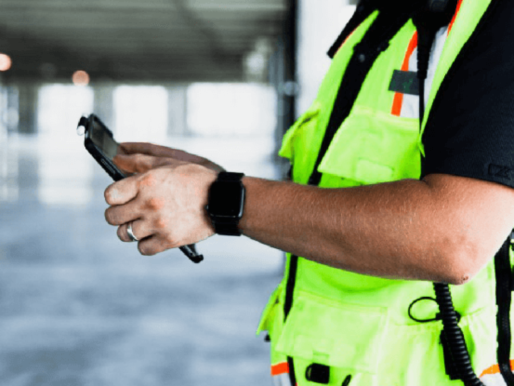Contractor using tablet on jobsite.