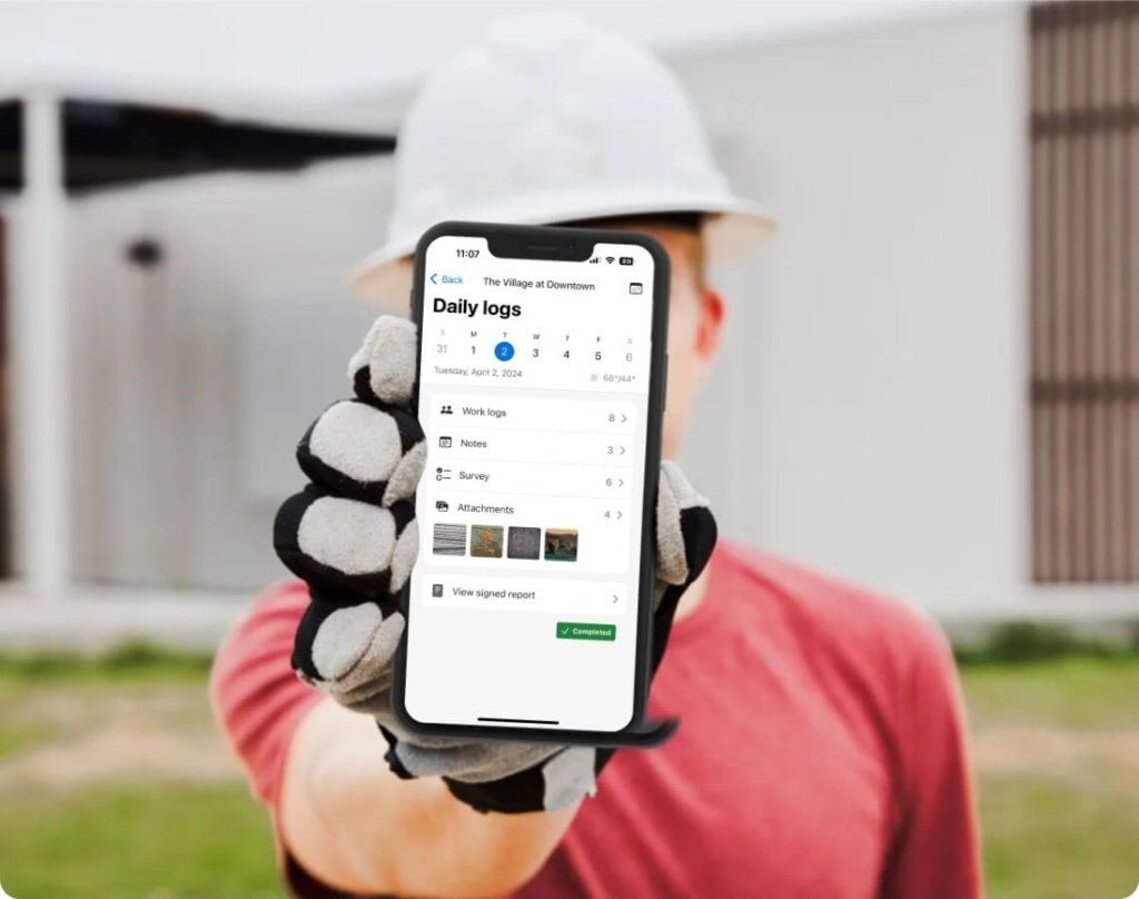 contractor using Raken's construction daily log app.