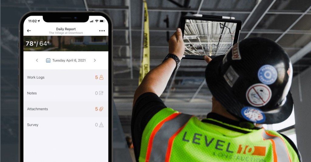 construction worker using construction report app to take photo on jobsite.