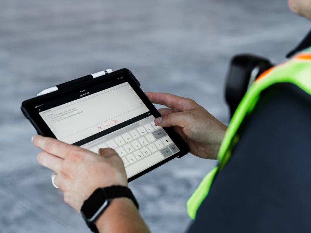 Construction worker using tablet.