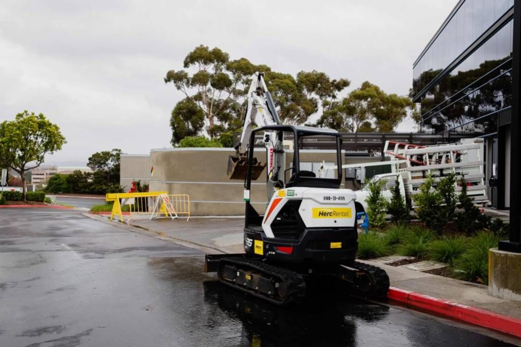 heavy construction equipment outside building.