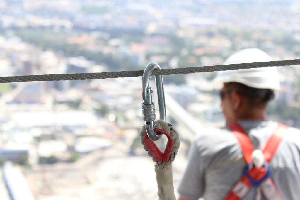 construction worker wearing safety harness.