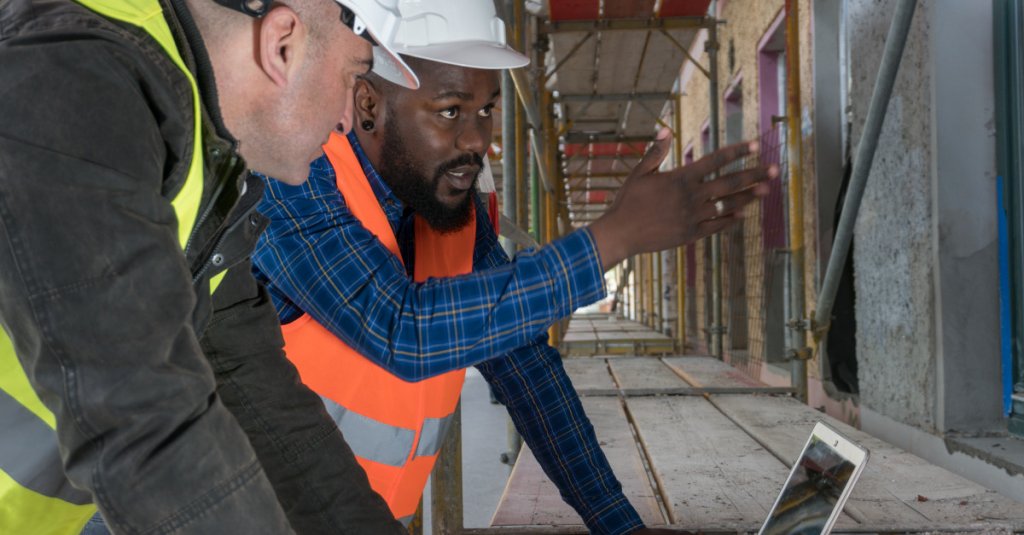 construction superintendent onboarding a new employee on the jobsite.
