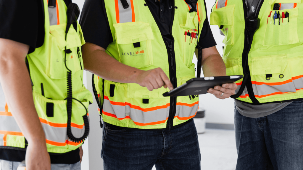 contractor using construction timesheet app on ipad.