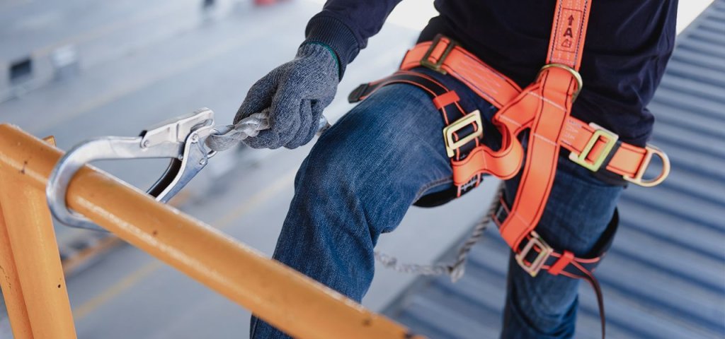 construction worker using a safety harness.