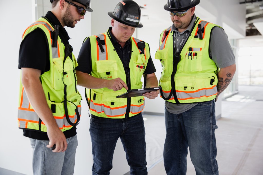 construction workers using iPad.