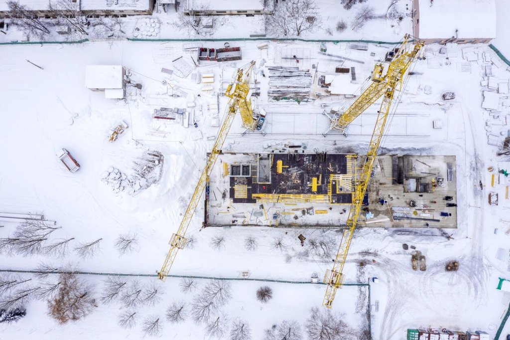 snowy conditions on construction site.