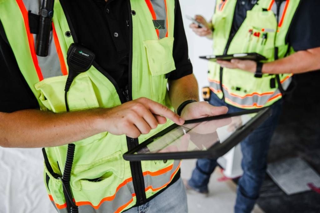 subcontractors using tablets on jobsite.