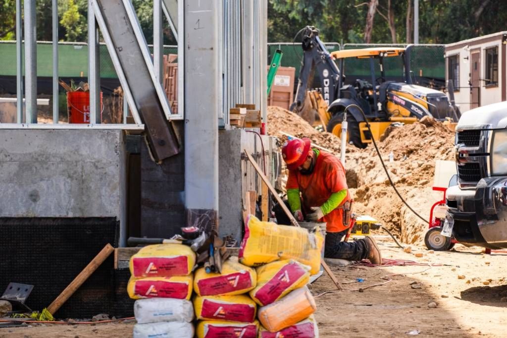 concrete subcontractor working on construction site.